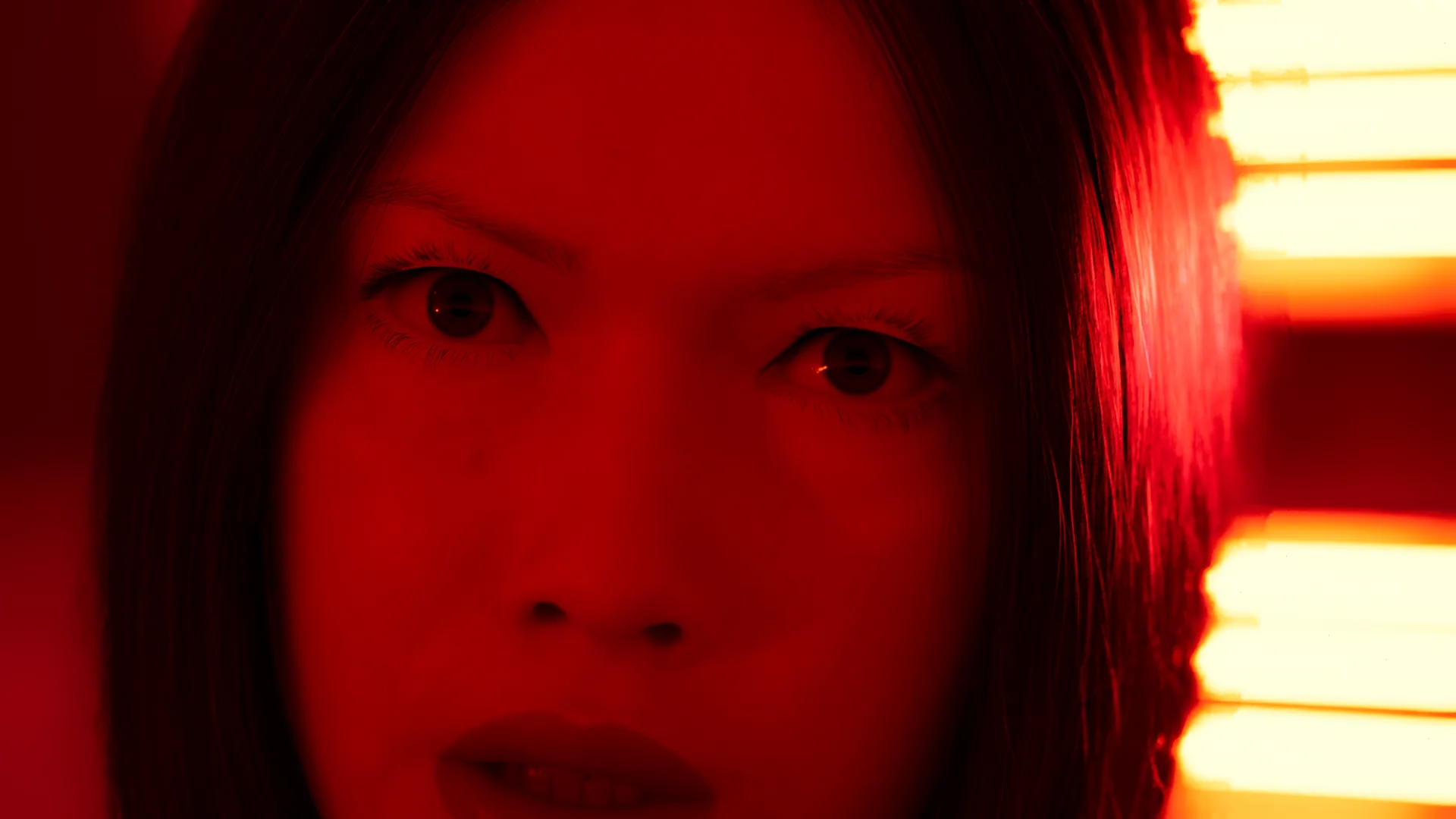 Close on her eyes in the red light, the first seconds of the take — a 4K frame